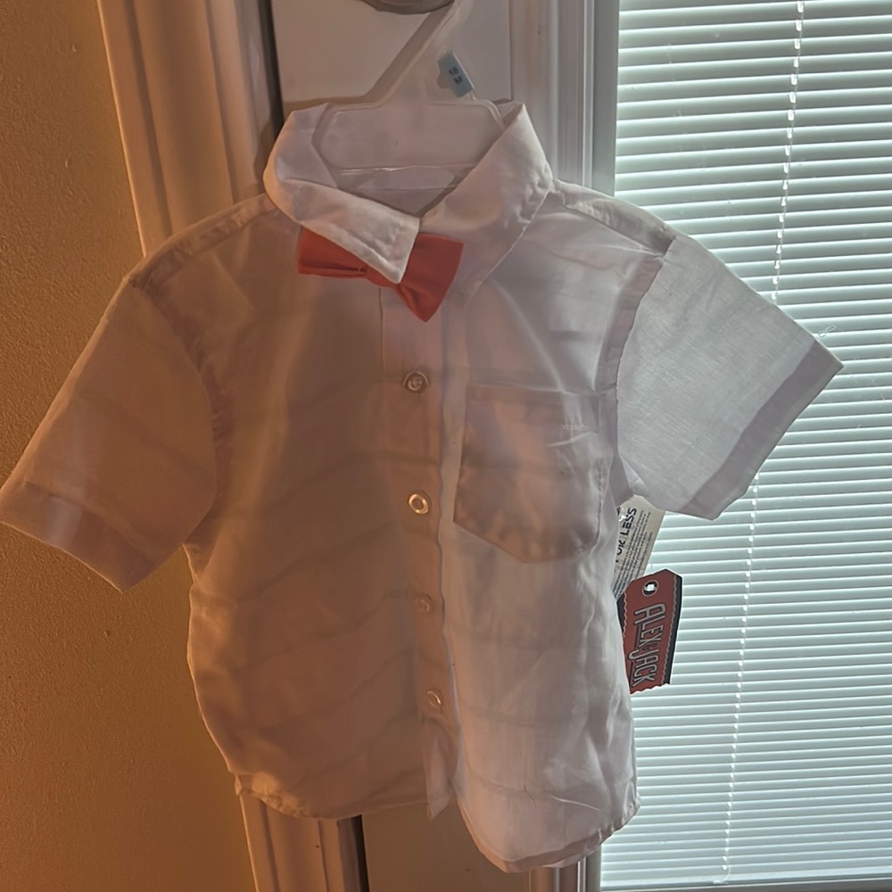 White dress shirt with orange bow tie